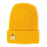 A yellow beanie with a yellow square ranger bear patch.