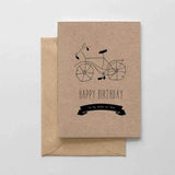 A brown card with a black text: "HAPPY BIRTHDAY TO MY RIDE OR DIE" and an illustration of a bicycle. Comes with a brown envelope.