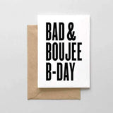 A white card with a black bold text: "BAD & BOUJEE B-DAY." Comes with a brown envelope.