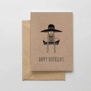 A brown card with a black text: "HAPPY BIRTHSLAY!" and an illustration of a lady with a big hat. Comes with a brown envelope.