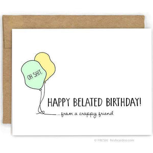 A white card with a black text: "HAPPY BELATED BIRTHDAY. FROM A CRAPPY FRIEND" and an illustration of two balloons. Comes with a brown envelope.