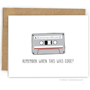 A white card with a black text: "REMEMBER WHEN THIS WAS COOL?" and an illsutration of a cassette tape.