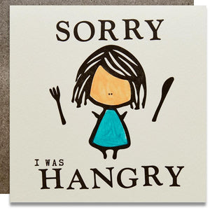 A white square card with text: "SORRY I WAS HANGRY" and an illustrations of a girl with a knife and a fork. Comes with a brown envelope.