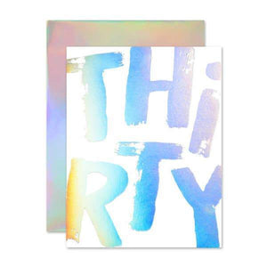 A white card with a holography text: "THIRTY"