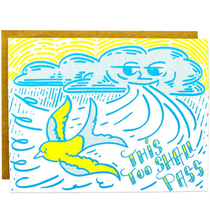 A card with an illustration of a cloud blowing a wind and a yellow bird flying away with a blue text: "THIS TOO SHALL PASS."